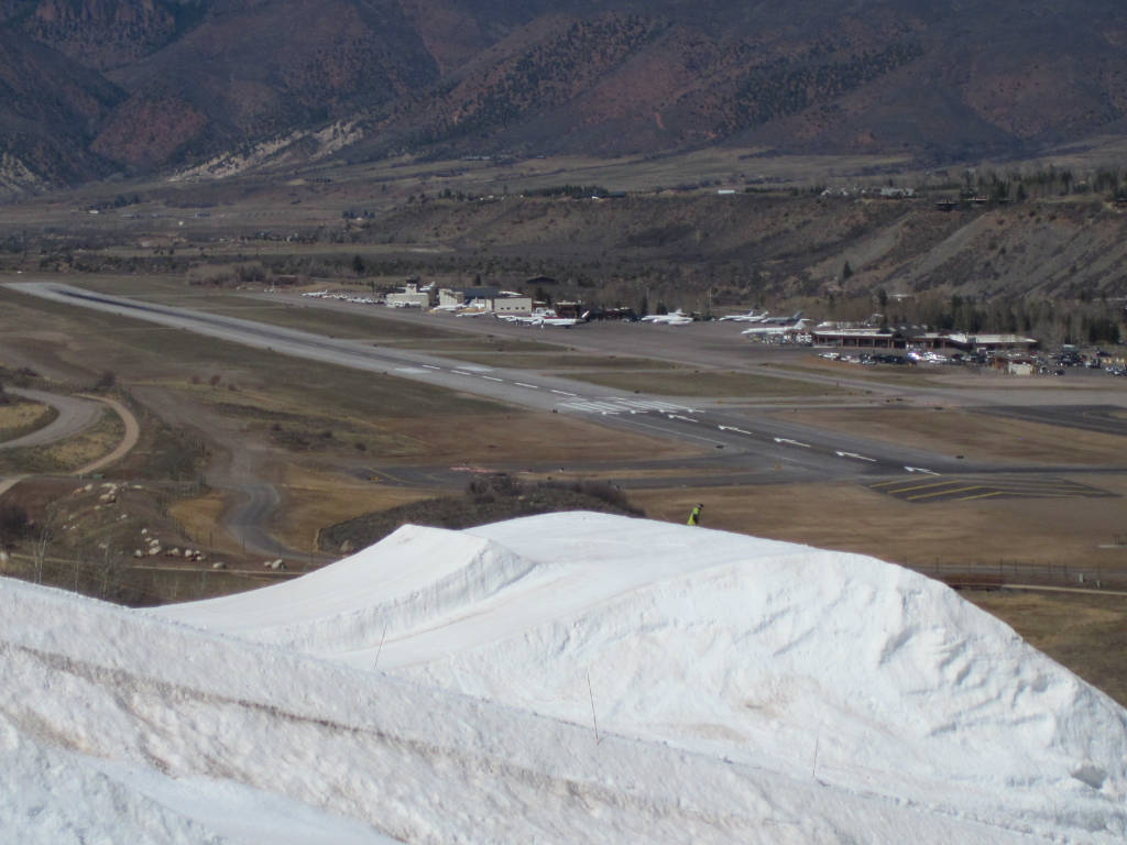 Aspen airport with Buttermilk terrain park ski jump in foreground and airport runway in background