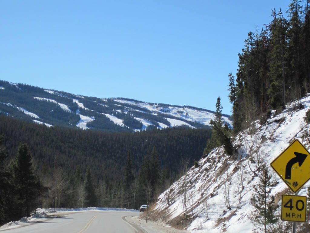 Descending Highway 6 on western side of Loveland Pass with Keystone Ski Resort in background