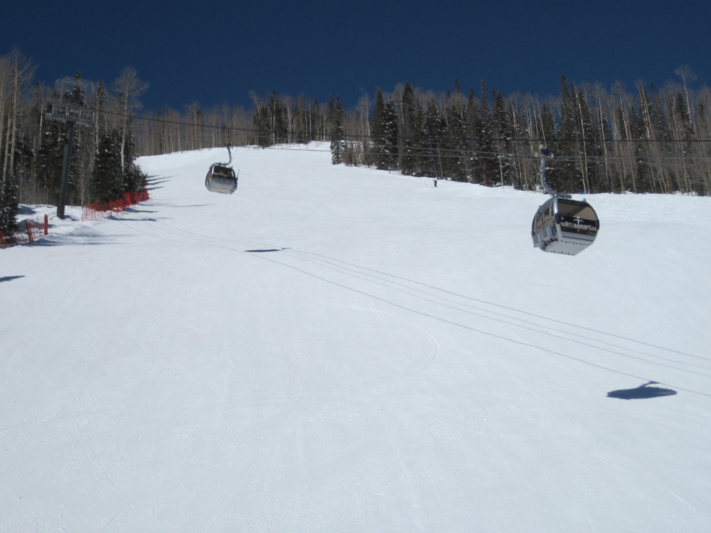 free gondola cabins above ski trail at Telluride Ski Resort