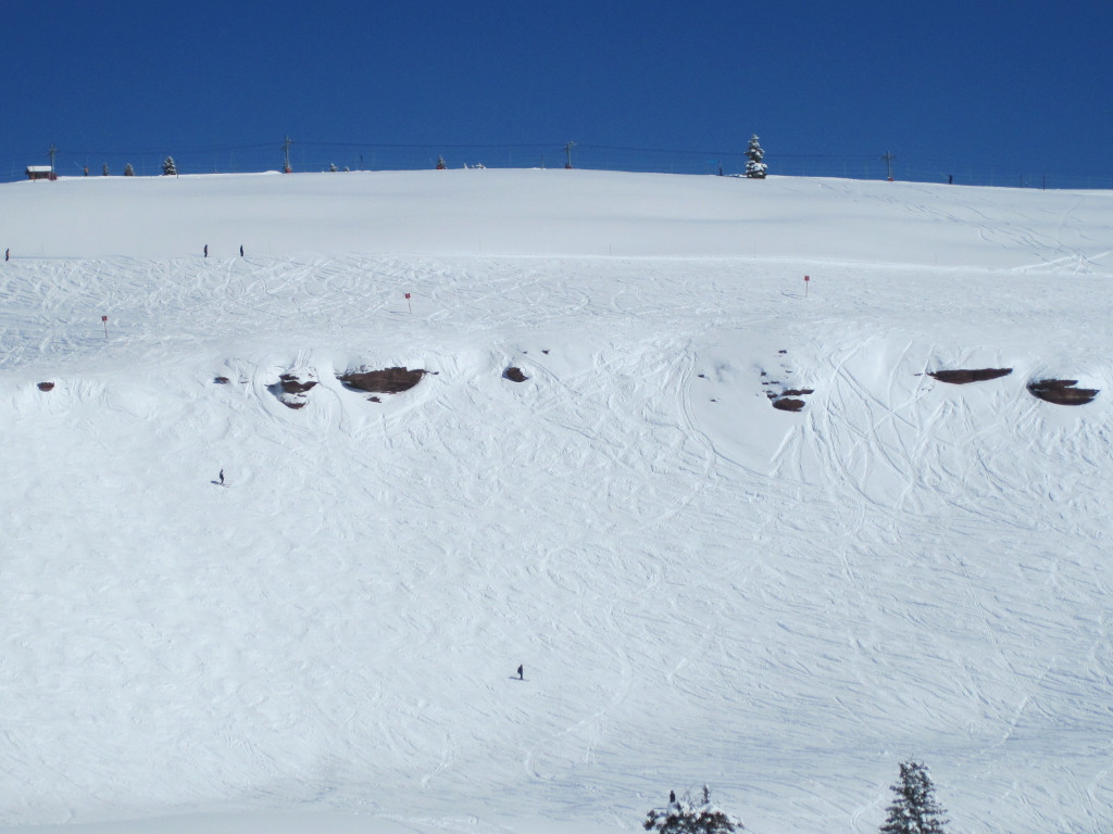 The Dragon's Teeth Cliffs on a powder day in Vail China Bowl