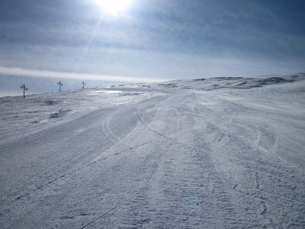 looking upward on groomed path on Rocky Mountain High ski trail near Snowmass summit