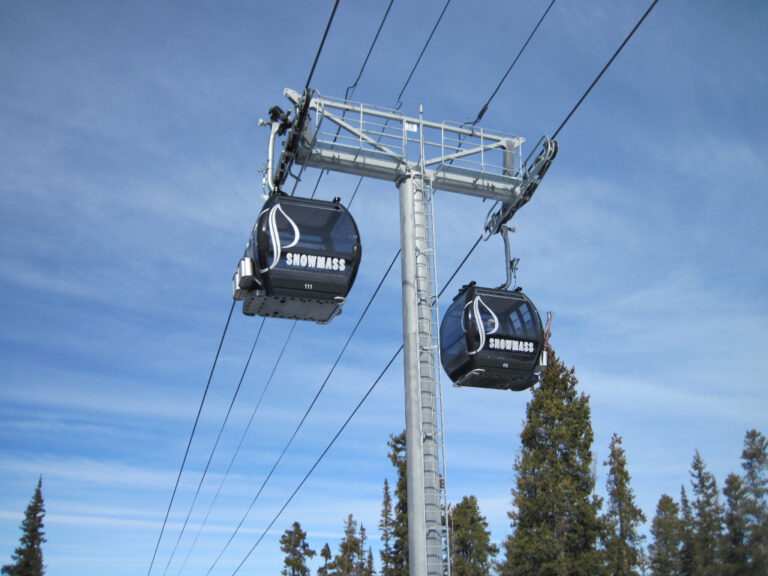 two passing cabins of the Snowmass Elk Camp Gondola