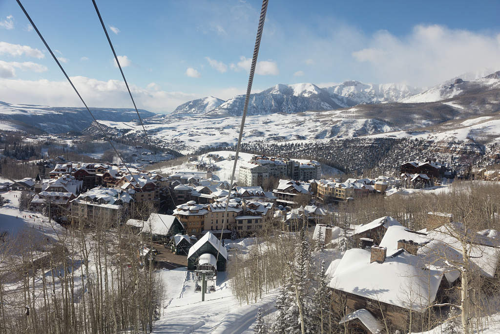 Looking down from a cabin in Telluride's free mountain gondola descending