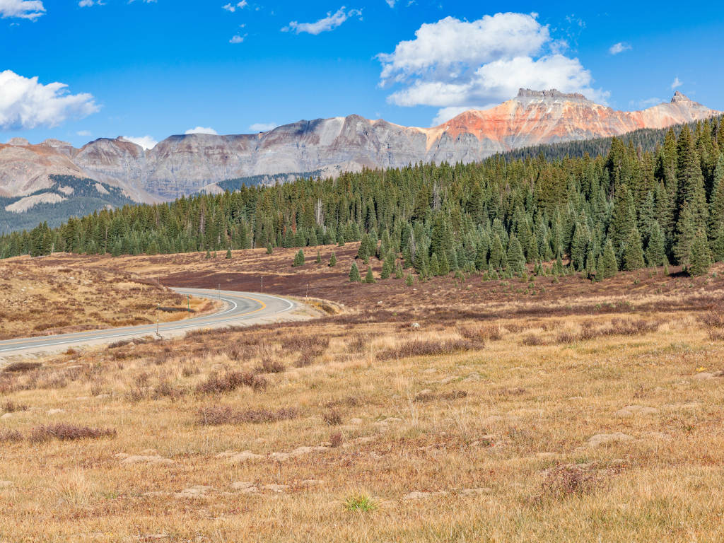 The roadway over Lizard Head Pass in Colorado with mountains in the background