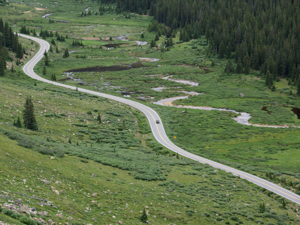 summer photo of Highway 82 winding on Independence Pass