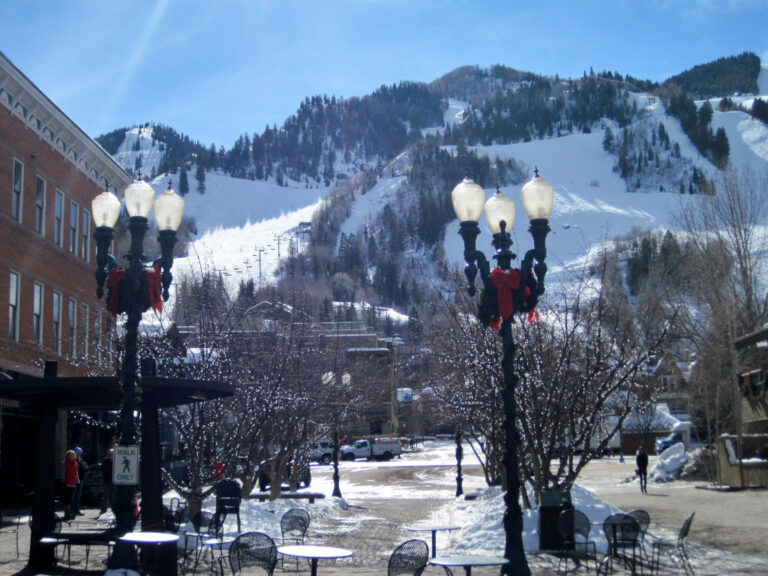 downtown Aspen, Colorado in winter with light posts and ski mountain in background