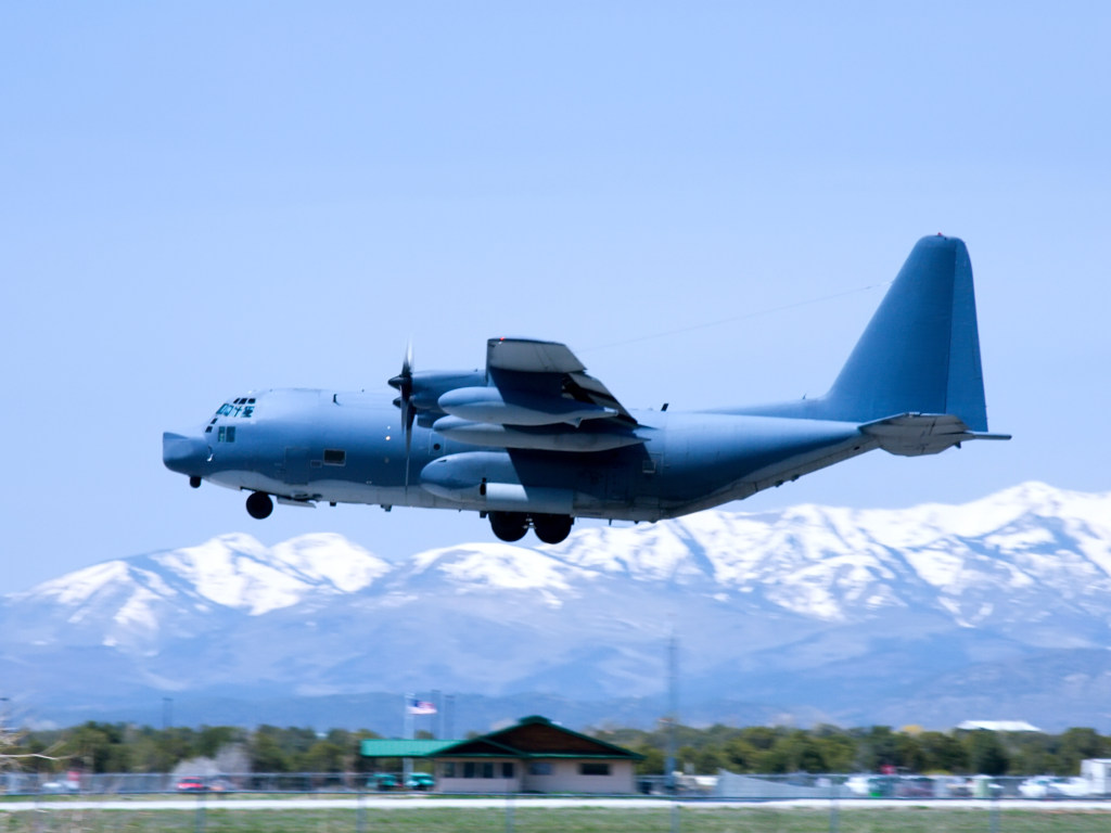 a C-130 Hercules flying above the airfield at Durango La Plata County Airport in Colorado