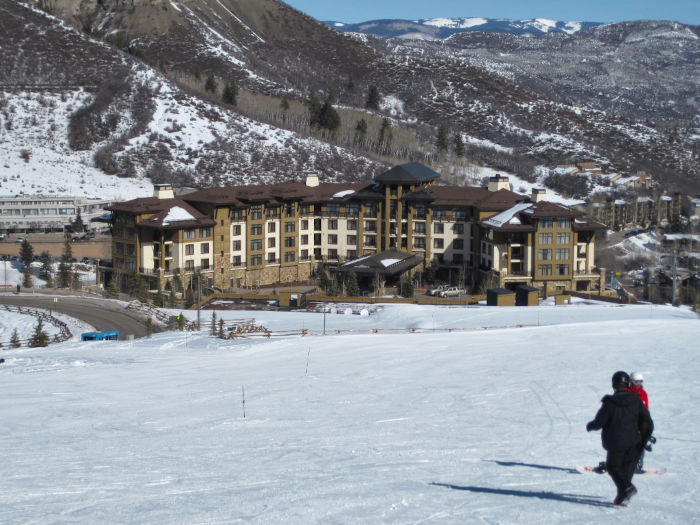 The Viceroy Hotel alongside of the ski slopes at Snowmass Colorado during winter with snow on ground