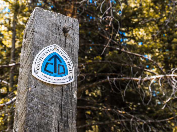 Continental Divide Trail marker on a wooden sign post