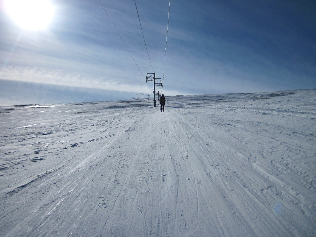 traveling up Cirque Poma surface lift at the top of Snowmass to access Rocky Mountain High ski trail