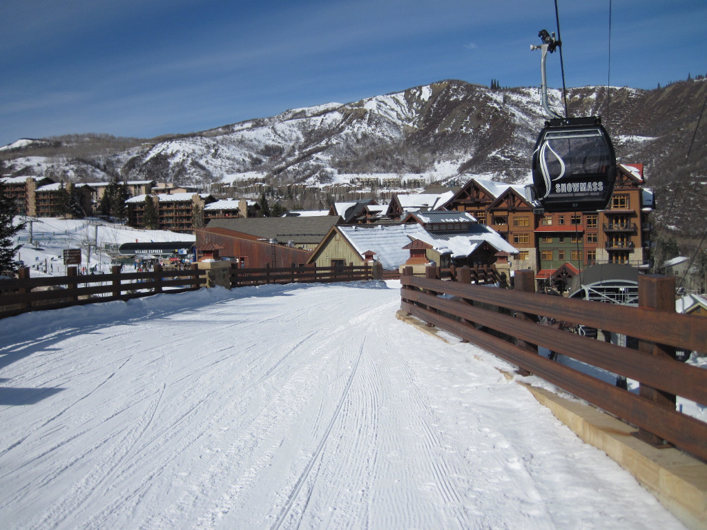 skier bridge in Snowmass Village with Elk Camp Gondola in winter