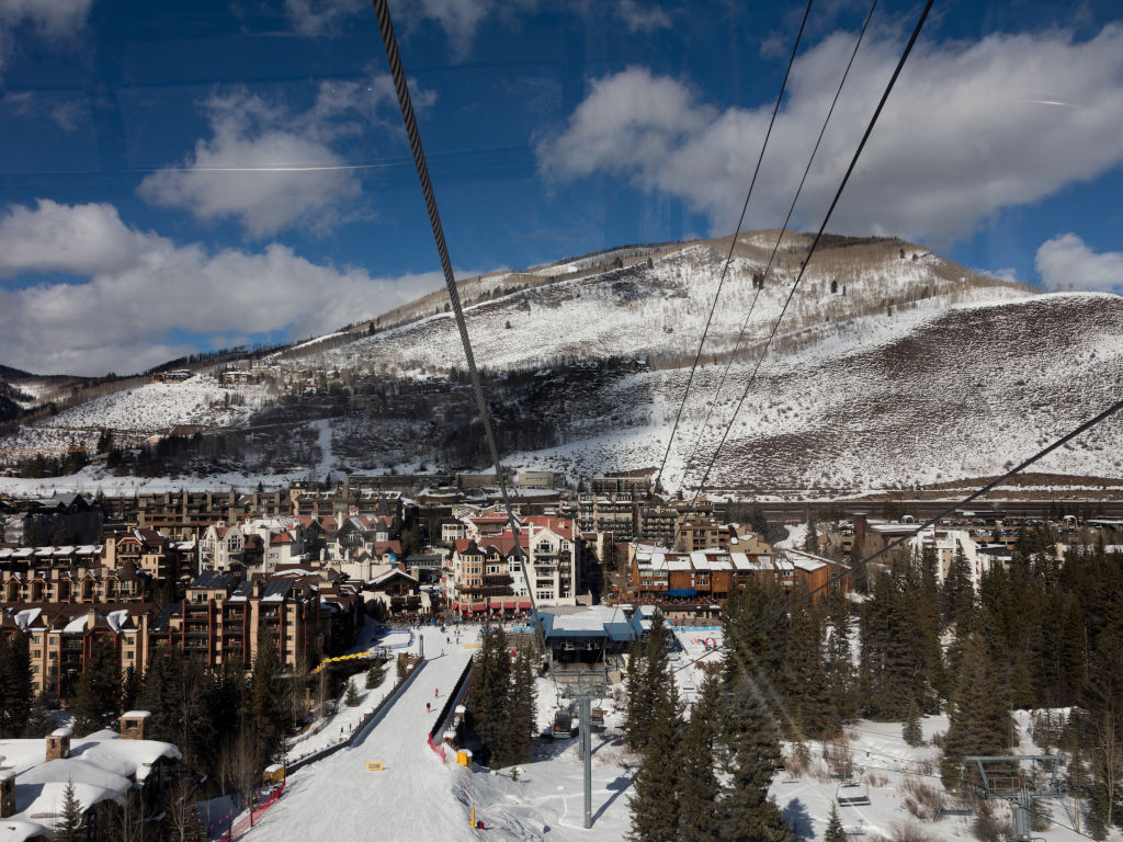 Looking down at the base station of the Eagle Bahn Gondola in Vail from inside of one of the gondola cabins