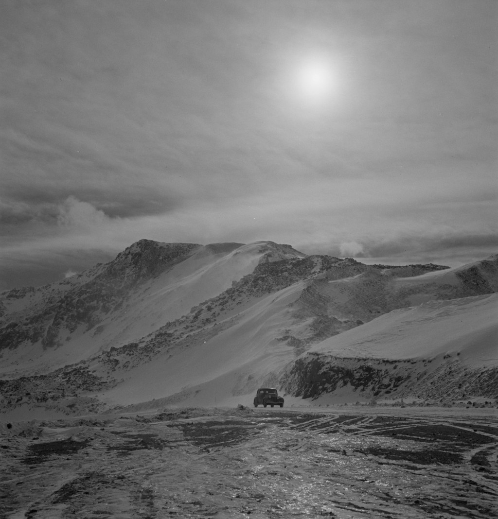 loveland pass historic photo from 1940s during winter with car near summit