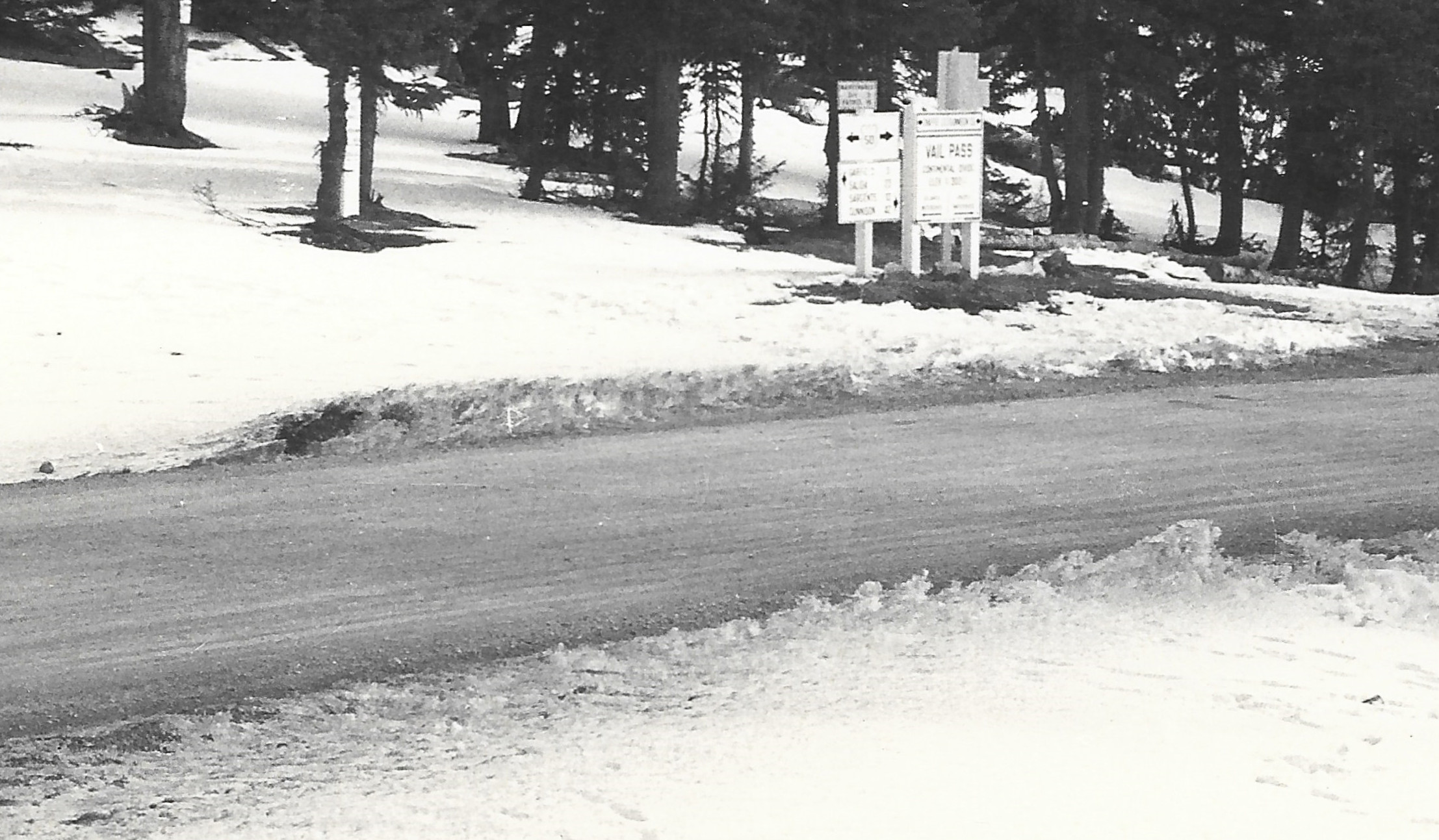 zoomed in view of monarch pass summit postcard ID CMO-W-1580​ showing road surface at summit of Monarch Pass when Vail Pass sign was here in 1939