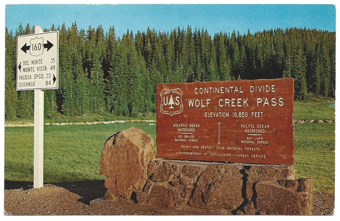 Full Scan of Wolf Creek Pass Continental Divide Sign postcard CWO-690