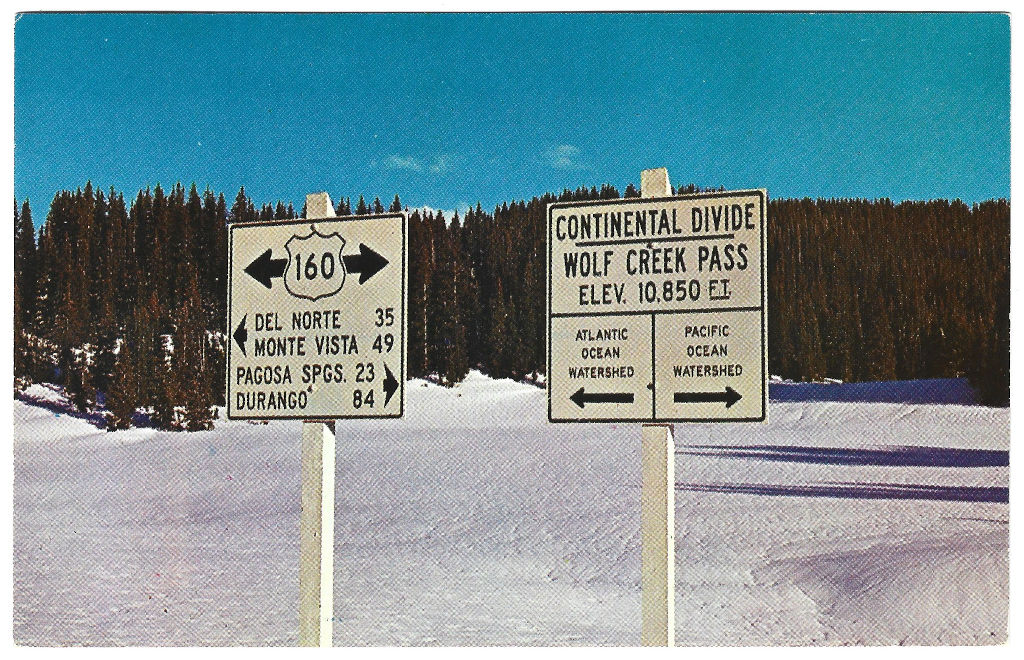 Full Scan of Wolf Creek Pass Continental Divide Sign postcard CWO-S32788-1 postmarked 1964