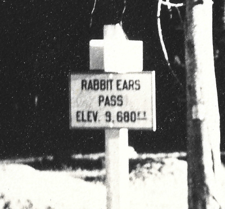 enhanced sign from 1944 Rabbit Ears Pass Continental Divide sign photograph with motorcycle by soldier on furlough