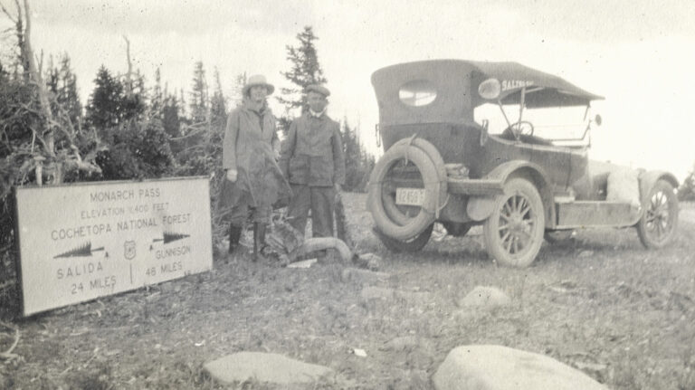 1918 Monarch Pass photograph with Continental Divide sign and people and a car on top of pass CMO-72918